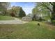 Sprawling property with lush greenery, a guest house, and a winding driveway at 281 Piedmont Ne Rd, Marietta, GA 30066