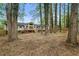 The house has a large deck overlooking a private backyard and the landscape has mature trees and new fence at 3805 Cloudland Se Dr, Smyrna, GA 30082