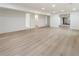Large finished basement with light wood floors and access to bathroom at 3805 Cloudland Se Dr, Smyrna, GA 30082