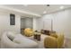 Finished basement features modern furniture, light wood floors, and recessed lighting at 3805 Cloudland Se Dr, Smyrna, GA 30082