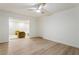 Finished basement with ceiling fan, wood floor, and access to living space at 3805 Cloudland Se Dr, Smyrna, GA 30082