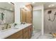 Elegant bathroom featuring double sinks, modern gold fixtures, and a spacious walk-in shower at 3805 Cloudland Se Dr, Smyrna, GA 30082