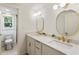 Bright bathroom with double vanity, white countertops, and gold fixtures at 3805 Cloudland Se Dr, Smyrna, GA 30082