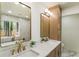Bright bathroom boasting double sinks, modern fixtures, and natural light from the window at 3805 Cloudland Se Dr, Smyrna, GA 30082