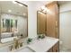 Bright bathroom boasting double sinks, modern fixtures, and natural light from the window at 3805 Cloudland Se Dr, Smyrna, GA 30082