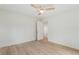 Bright bedroom with hardwood floors, a ceiling fan, and an open doorway at 3805 Cloudland Se Dr, Smyrna, GA 30082