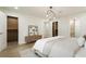 This bedroom features a platform bed, a media console, and doorways leading to closets and a bathroom at 3805 Cloudland Se Dr, Smyrna, GA 30082