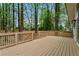 A spacious deck for outdoor relaxation, complete with secure railing and wooded views at 3805 Cloudland Se Dr, Smyrna, GA 30082