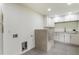 Dog wash station features granite counter, white cabinets, and modern fixtures at 3805 Cloudland Se Dr, Smyrna, GA 30082