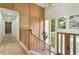 Welcoming entryway with wood paneled walls, modern lighting, and view of the front yard at 3805 Cloudland Se Dr, Smyrna, GA 30082