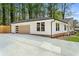 View of the garage and modern architecture of this remodeled home at 3805 Cloudland Se Dr, Smyrna, GA 30082