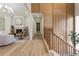 Bright hallway that leads to the living room with hardwood floors, and modern lighting at 3805 Cloudland Se Dr, Smyrna, GA 30082