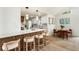 Modern kitchen with an island, bar stool seating, and an adjacent dining area at 3805 Cloudland Se Dr, Smyrna, GA 30082