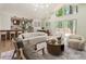 Open-concept living area with stylish furniture and views of the outdoor scenery at 3805 Cloudland Se Dr, Smyrna, GA 30082