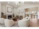 Bright living room features a fireplace, stylish furniture, and modern lighting at 3805 Cloudland Se Dr, Smyrna, GA 30082