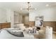 Bright living room with hardwood floors, many seats, modern lighting, and paneled accent wall at 3805 Cloudland Se Dr, Smyrna, GA 30082