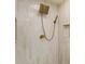 This bathroom features a bronze rainfall shower head and handheld sprayer with vertical light stone-patterned shower walls at 3805 Cloudland Se Dr, Smyrna, GA 30082