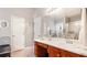 Bright bathroom with a large vanity, framed mirror and walk in shower with modern fixtures at 4014 Ivy Trace Ln, Ellenwood, GA 30294