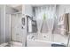 Full bathroom showcasing a shower over tub, vanity and bright natural light at 4014 Ivy Trace Ln, Ellenwood, GA 30294