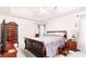 Serene main bedroom with a tray ceiling, plush bedding, and dark wood furniture at 4014 Ivy Trace Ln, Ellenwood, GA 30294