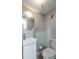 This bathroom offers a modern sink, round mirror, and a toilet at 771 Jordan Ln # K, Decatur, GA 30033