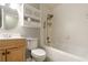 A bathroom featuring a tub and shower combo and cabinet with matching mirror at 771 Jordan Ln # K, Decatur, GA 30033