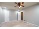 Neutral bedroom features a ceiling fan and open closet door at 771 Jordan Ln # K, Decatur, GA 30033
