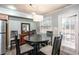 The dining area features a dark wood table, chairs, and patio view at 771 Jordan Ln # K, Decatur, GA 30033