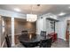 Open dining area with a view into the kitchen and living space at 771 Jordan Ln # K, Decatur, GA 30033