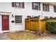 Charming townhome featuring a red front door and red shutters with a white brick exterior at 771 Jordan Ln # K, Decatur, GA 30033