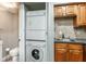 Laundry room features washer and dryer beside sink and cabinets at 771 Jordan Ln # K, Decatur, GA 30033