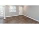 Bright living space with wood-look flooring, white trim, and lots of natural light at 771 Jordan Ln # K, Decatur, GA 30033
