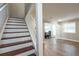 View of staircase and dining area with wood-look flooring at 771 Jordan Ln # K, Decatur, GA 30033