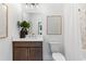 Modern bathroom features a vanity with a vessel sink, a large mirror and a shower with marble tile at 2531 Astaire Ct, Atlanta, GA 30318