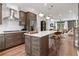 Open kitchen features an island with seating, stainless appliances, and opens to the living room at 2531 Astaire Ct, Atlanta, GA 30318