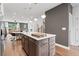 Gourmet kitchen with quartz countertops, stainless steel appliances, and center island with pendant lighting at 2531 Astaire Ct, Atlanta, GA 30318