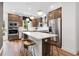 Modern kitchen features stainless steel appliances, a large island with seating, and stylish pendant lighting at 2531 Astaire Ct, Atlanta, GA 30318