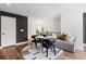 Chic living space with modern furniture, designer rug, and hardwood flooring throughout at 2531 Astaire Ct, Atlanta, GA 30318