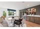 Modern living room with a wet bar, wine storage, stylish seating, and natural lighting at 2531 Astaire Ct, Atlanta, GA 30318