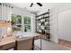 Well-lit home office with a stylish desk, open shelving, and inviting decor at 2531 Astaire Ct, Atlanta, GA 30318
