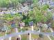 An aerial view of houses nestled among lush trees and winding streets at 2739 Springfount Trl, Lawrenceville, GA 30043