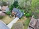View of a two-story brick home with lush landscaping and a well-maintained lawn at 2739 Springfount Trl, Lawrenceville, GA 30043