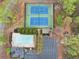 Aerial view showcasing the community pool, tennis courts, playground, and parking at 2739 Springfount Trl, Lawrenceville, GA 30043