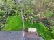 An aerial view of a well-manicured lawn and garden, enhanced by mature trees at 2739 Springfount Trl, Lawrenceville, GA 30043