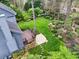 A lush backyard featuring a wooden deck, stone patio and meticulously manicured lawn at 2739 Springfount Trl, Lawrenceville, GA 30043