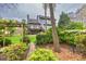 Exterior backyard showcasing lush landscaping, second story deck, and pergola, ideal for outdoor entertaining at 2739 Springfount Trl, Lawrenceville, GA 30043