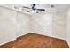 A finished basement area with plank floors, a ceiling fan, and a white door at 2739 Springfount Trl, Lawrenceville, GA 30043