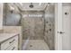 The bathroom features a glass enclosed shower with gray tile surround and a vanity with white cabinets at 2739 Springfount Trl, Lawrenceville, GA 30043