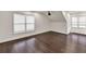An angled bonus room with hardwood floors and ample natural light from two windows at 2739 Springfount Trl, Lawrenceville, GA 30043
