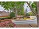 A beautiful community entrance sign with flowerbeds and lush greenery at 2739 Springfount Trl, Lawrenceville, GA 30043